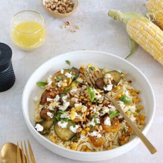This corn and zucchini orzo salad with goat cheese is tossed together with a cumin vinaigrette and some mint for a very refreshing touch.
