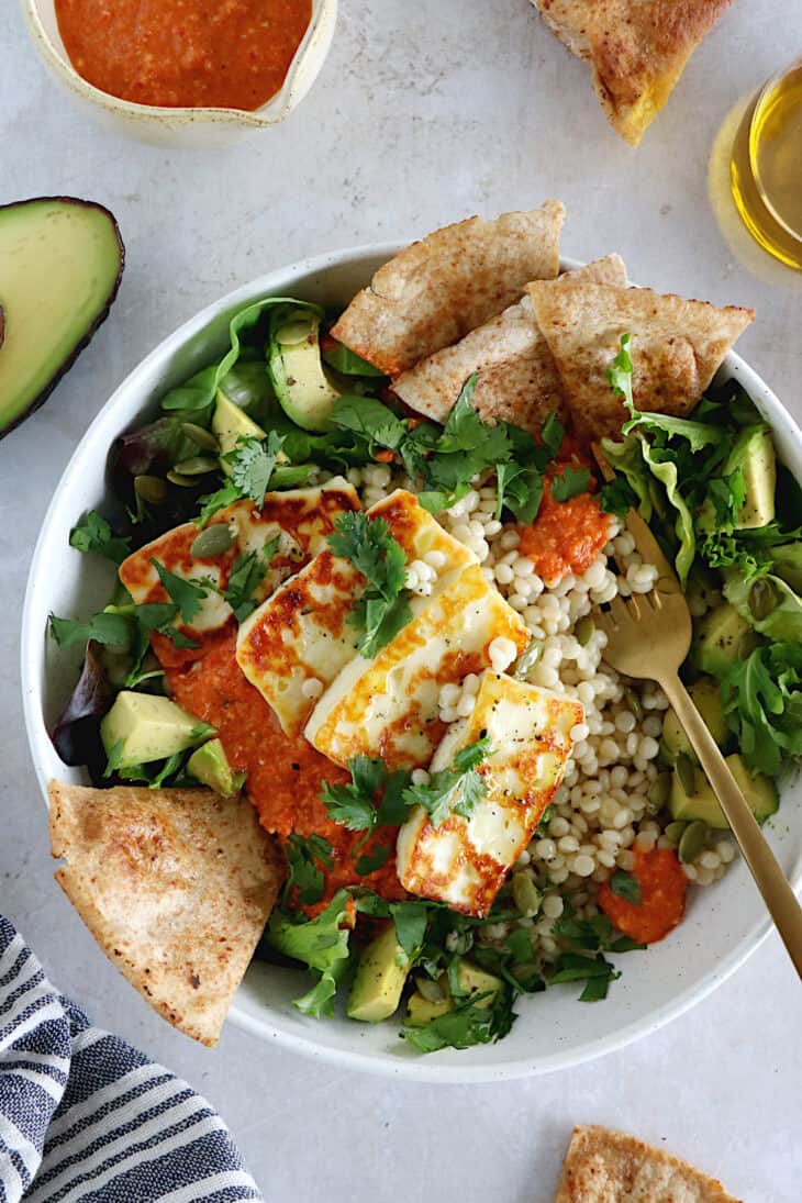 This romesco pearl couscous bowl with grilled halloumi is vegetarian, wholesome and loaded with flavors.