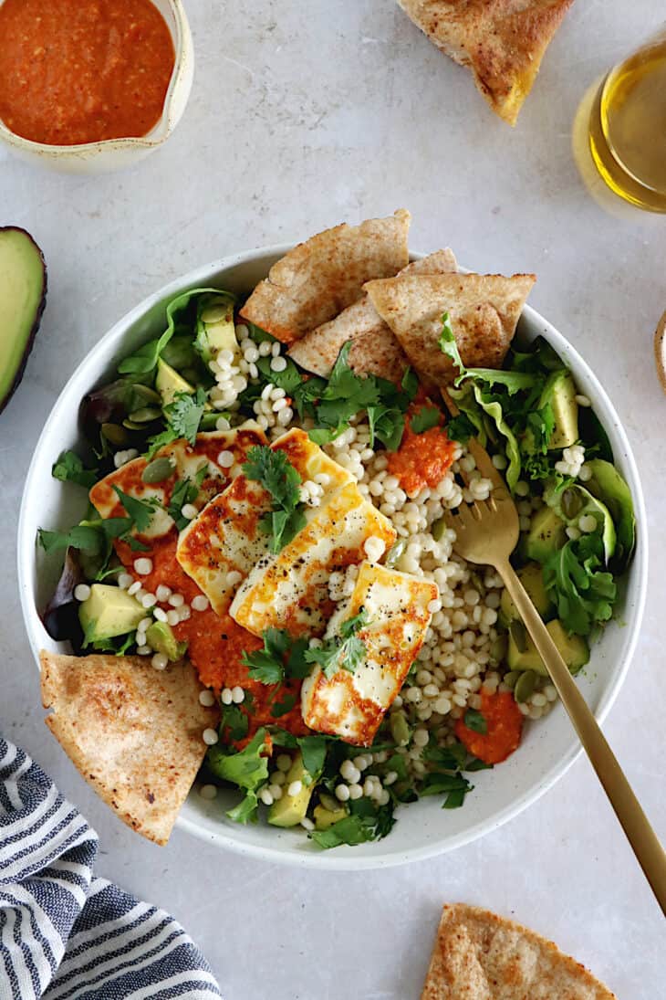 This romesco pearl couscous bowl with grilled halloumi is vegetarian, wholesome and loaded with flavors.