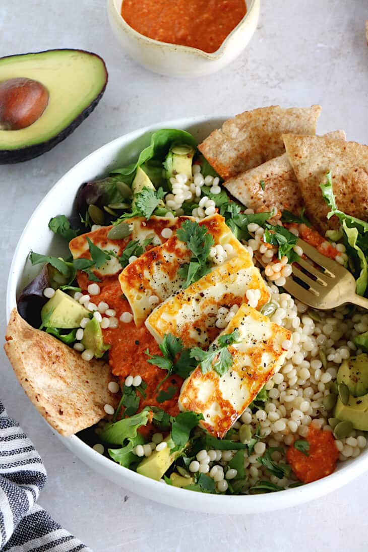 This romesco pearl couscous bowl with grilled halloumi is vegetarian, wholesome and loaded with flavors.