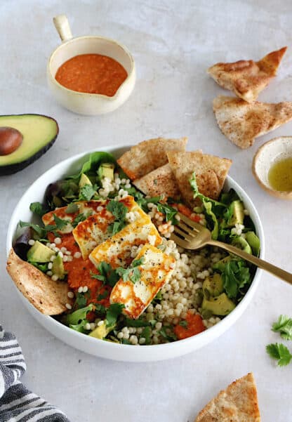 This romesco pearl couscous bowl with grilled halloumi is vegetarian, wholesome and loaded with flavors.