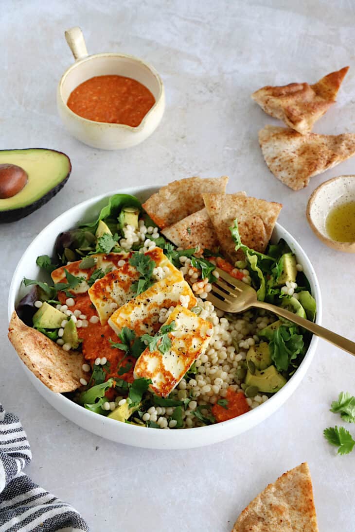 This romesco pearl couscous bowl with grilled halloumi is vegetarian, wholesome and loaded with flavors.
