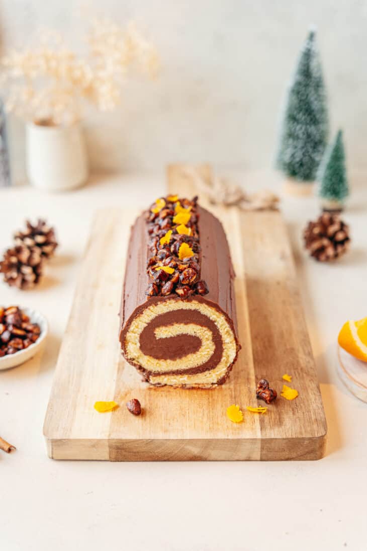 This chocolate orange yule log (or bûche de Noël in French) is a traditional Christmas dessert in France. It consists of a light sponge cake, subtly flavored with orange, and a generous chocolate ganache.