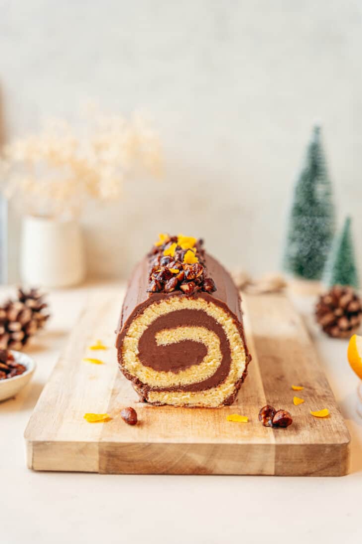 This chocolate orange yule log (or bûche de Noël in French) is a traditional Christmas dessert in France. It consists of a light sponge cake, subtly flavored with orange, and a generous chocolate ganache.