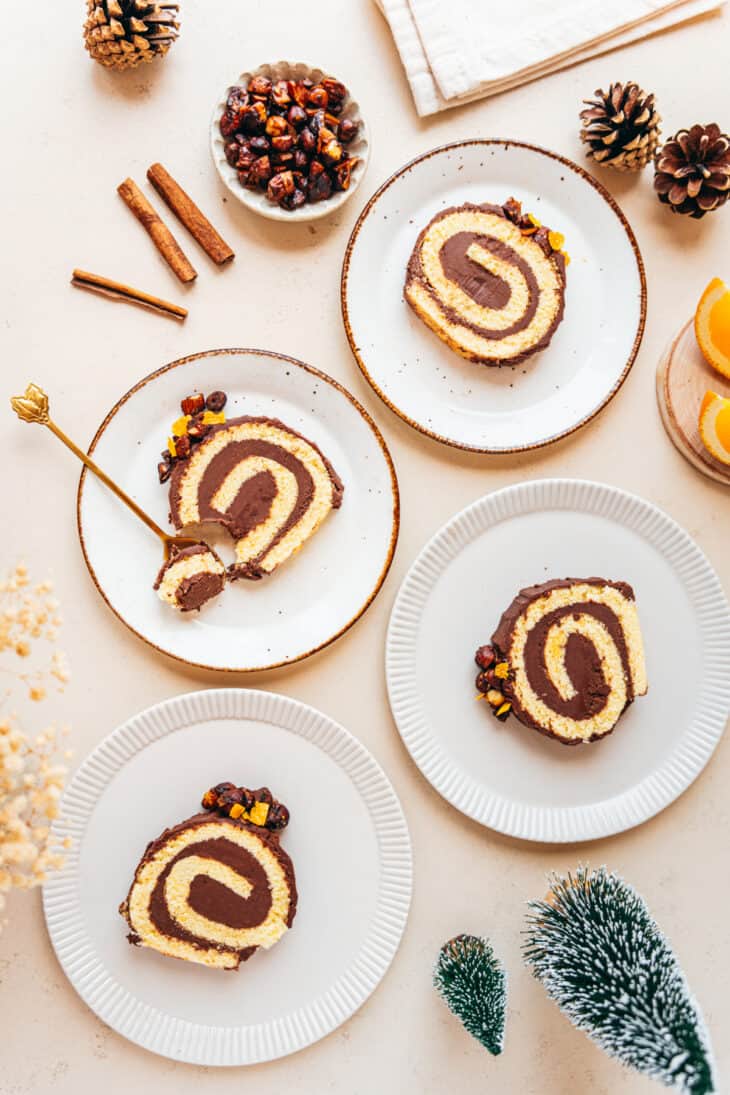 This chocolate orange yule log (or bûche de Noël in French) is a traditional Christmas dessert in France. It consists of a light sponge cake, subtly flavored with orange, and a generous chocolate ganache.