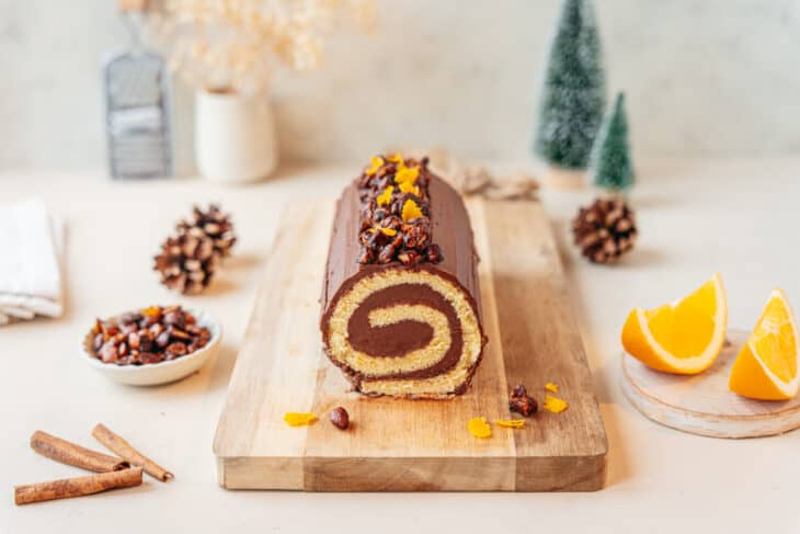 This chocolate orange yule log (or bûche de Noël in French) is a traditional Christmas dessert in France. It consists of a light sponge cake, subtly flavored with orange, and a generous chocolate ganache.