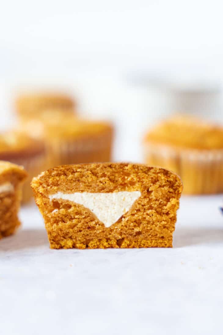 Pumpkin cream cheese muffins are perfectly moist and tender, packed with some delicious pumpkin spice, and filled with a soft cream cheese center.