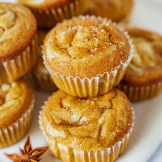 Pumpkin cream cheese muffins are perfectly moist and tender, packed with some delicious pumpkin spice, and filled with a soft cream cheese center.