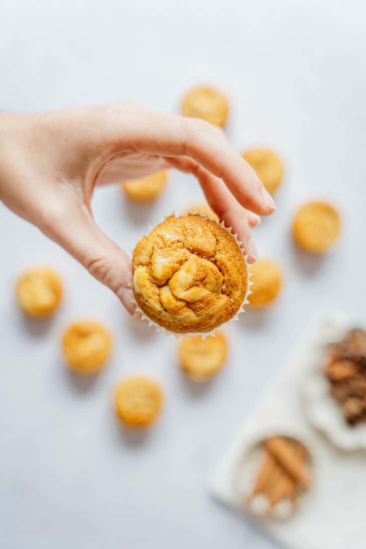 Pumpkin cream cheese muffins are perfectly moist and tender, packed with some delicious pumpkin spice, and filled with a soft cream cheese center.