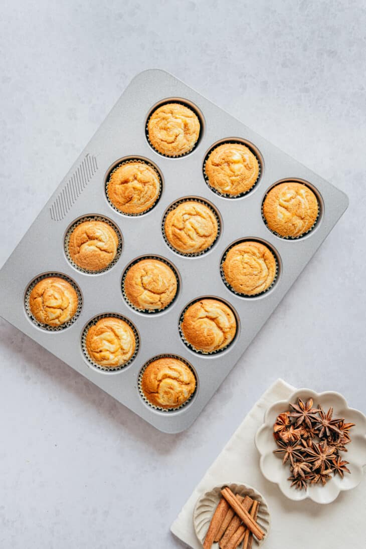 Pumpkin cream cheese muffins are perfectly moist and tender, packed with some delicious pumpkin spice, and filled with a soft cream cheese center.