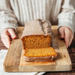 Here's the BEST pumpkin bread recipe. Extremely moist and tender, it's loaded with pumpkin spice flavors, and topped with a delicious cinnamon icing.