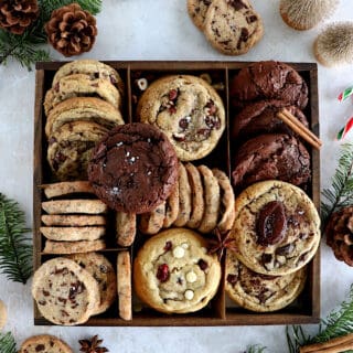 This festive Christmas cookie box is filled with your favorite cookies, ranging from chocolate brownie cookies, shortbread cookies, white chocolate and cranberry cookies, and more.
