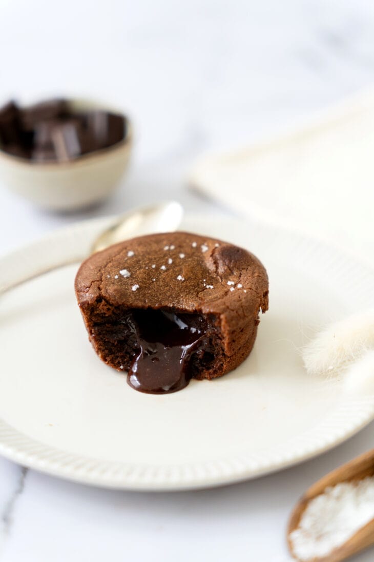 Molten chocolate lava cake is a decadent individual dessert, with a mind-blowing gooey chocolate center that flows out when you slice it.