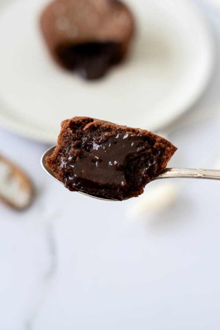 Molten chocolate lava cake is a decadent individual dessert, with a mind-blowing gooey chocolate center that flows out when you slice it.