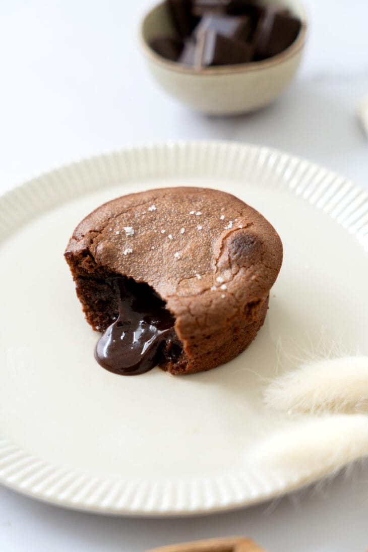 Molten chocolate lava cake is a decadent individual dessert, with a mind-blowing gooey chocolate center that flows out when you slice it.