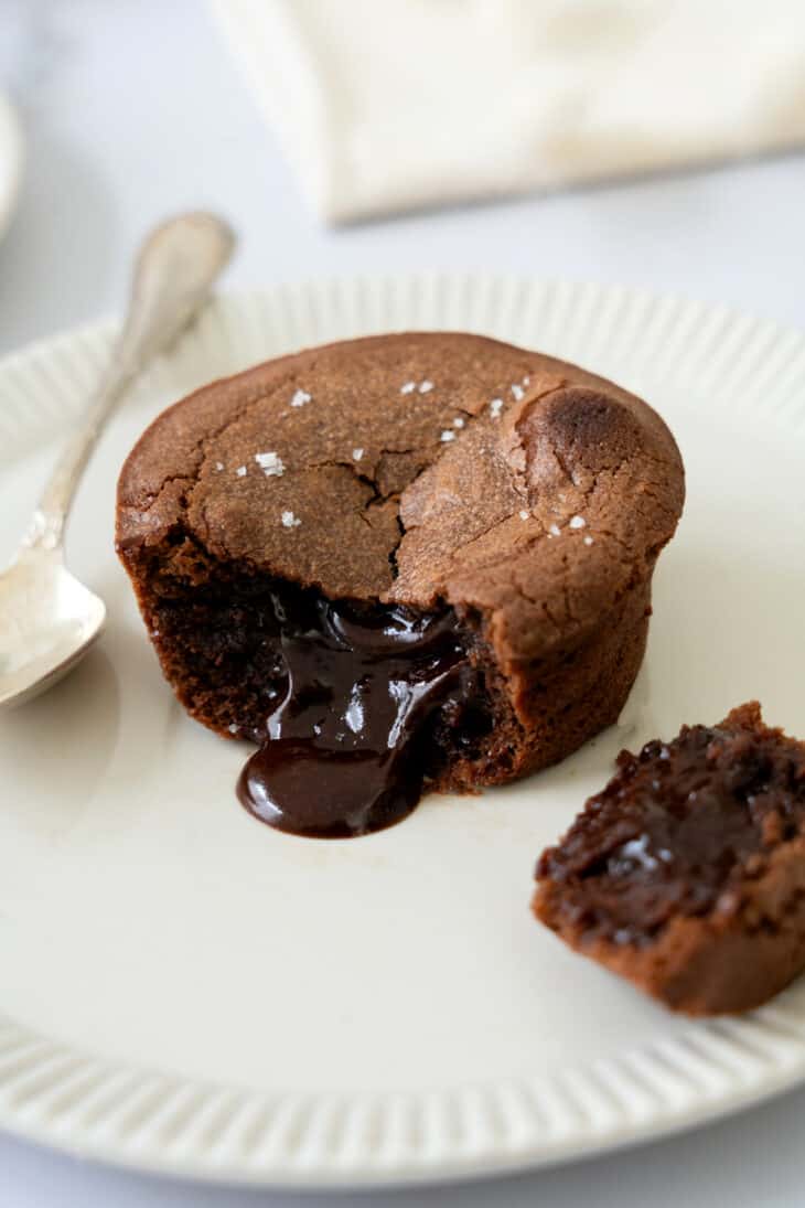 Molten chocolate lava cake is a decadent individual dessert, with a mind-blowing gooey chocolate center that flows out when you slice it.