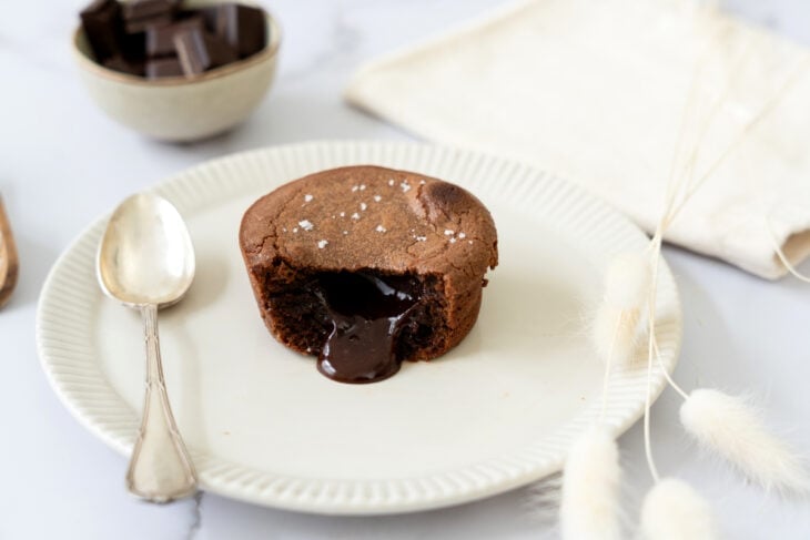 Molten chocolate lava cake is a decadent individual dessert, with a mind-blowing gooey chocolate center that flows out when you slice it.