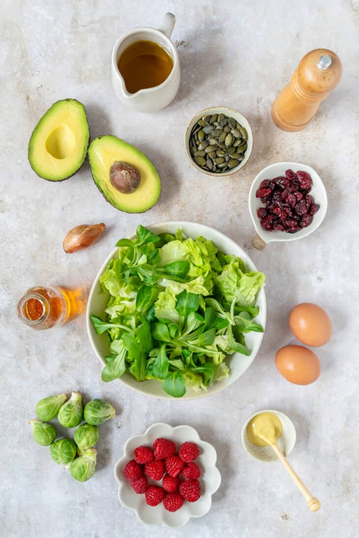 This vibrant avocado raspberry salad with soft-boiled eggs comes with a sweet and subtle raspberry vinaigrette.