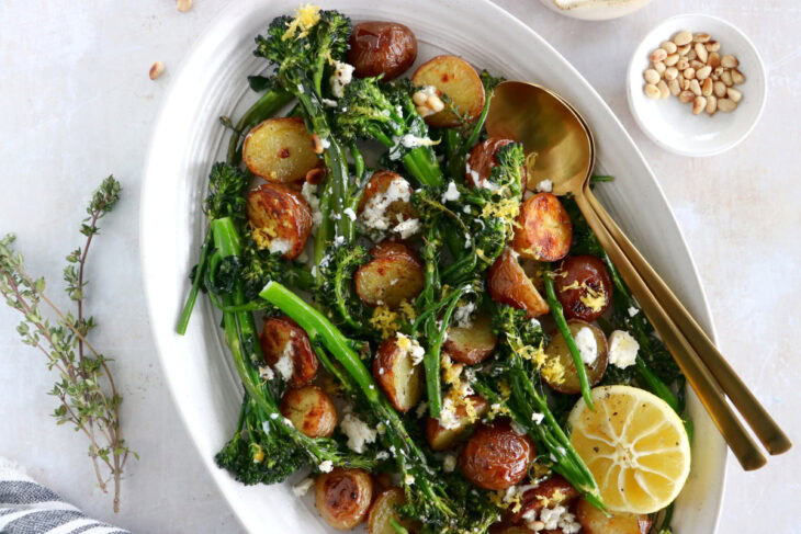 Lemony roasted broccolini and potatoes with feta-yogurt dip is an elegant vegetarian side or main that work for every occasion.