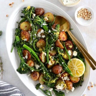 Lemony roasted broccolini and potatoes with feta-yogurt dip is an elegant vegetarian side or main that work for every occasion.