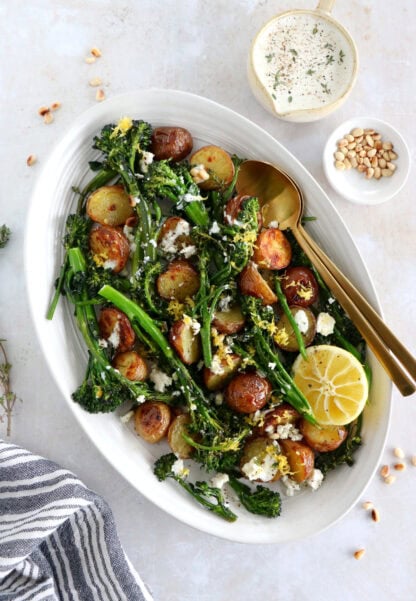 Lemony roasted broccolini and potatoes with feta-yogurt dip is an elegant vegetarian side or main that work for every occasion.