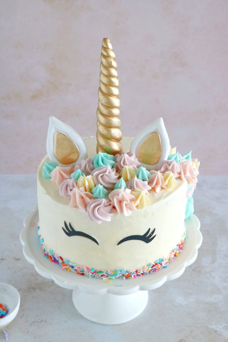 This unicorn cake is a 3-layer funfetti cake, covered with white and pastel buttercream. Perfect for a kid's birthday party or a baby shower.