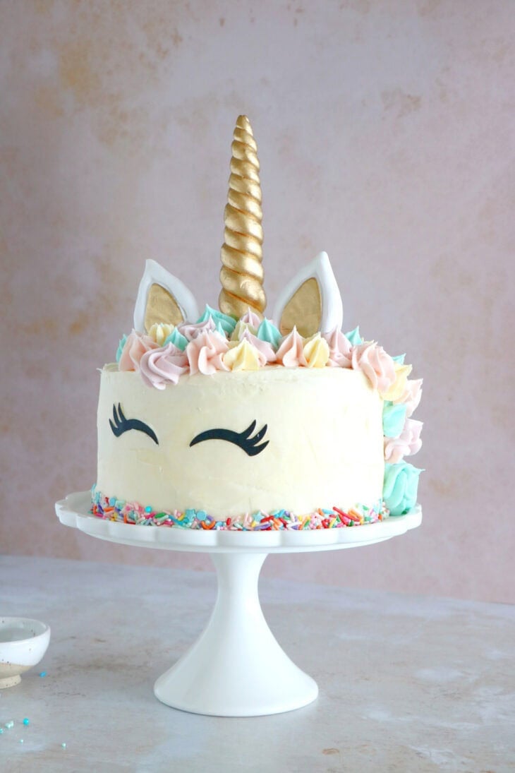 This unicorn cake is a 3-layer funfetti cake, covered with white and pastel buttercream. Perfect for a kid's birthday party or a baby shower.