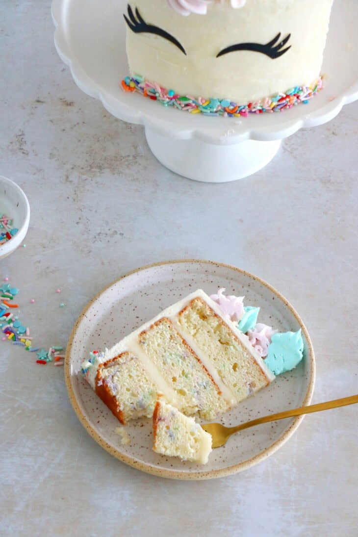This unicorn cake is a 3-layer funfetti cake, covered with white and pastel buttercream. Perfect for a kid's birthday party or a baby shower.