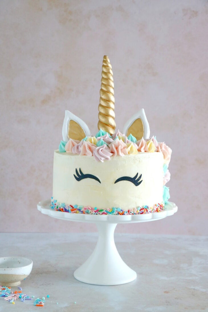 This unicorn cake is a 3-layer funfetti cake, covered with white and pastel buttercream. Perfect for a kid's birthday party or a baby shower.