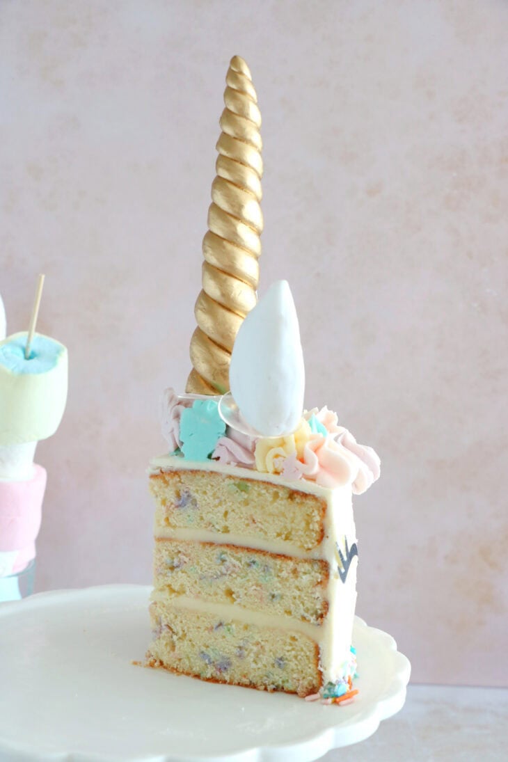 This unicorn cake is a 3-layer funfetti cake, covered with white and pastel buttercream. Perfect for a kid's birthday party or a baby shower.
