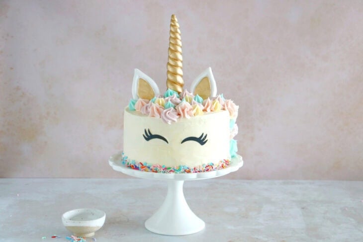 This unicorn cake is a 3-layer funfetti cake, covered with white and pastel buttercream. Perfect for a kid's birthday party or a baby shower.