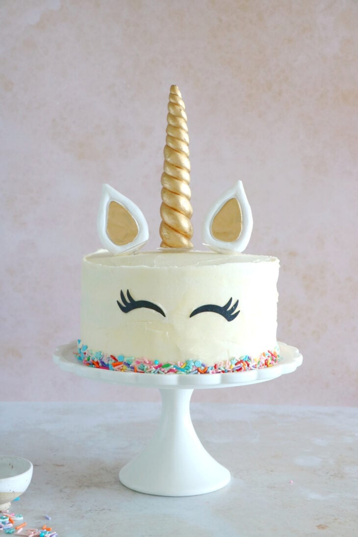 This unicorn cake is a 3-layer funfetti cake, covered with white and pastel buttercream. Perfect for a kid's birthday party or a baby shower.
