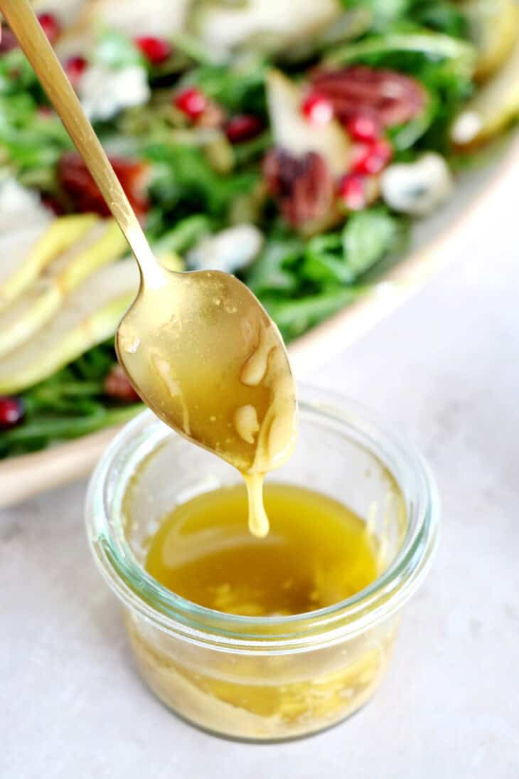 This simple arugula pear salad with blue cheese and pecans is light, fruity, crunchy, and tossed in a simple maple Dijon vinaigrette.