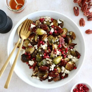Maple balsamic Brussels sprouts with feta, pomegranate and pecans make a fantastic side dish for the holidays.