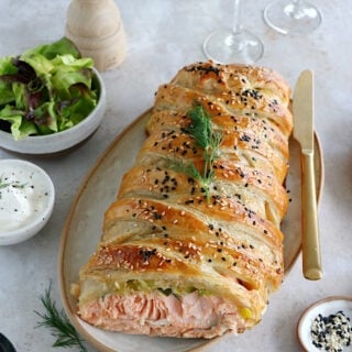 Puff pastry salmon wellington features a crispy golden puff pastry filled with a creamy leek-salmon filling, seasoned to perfection.