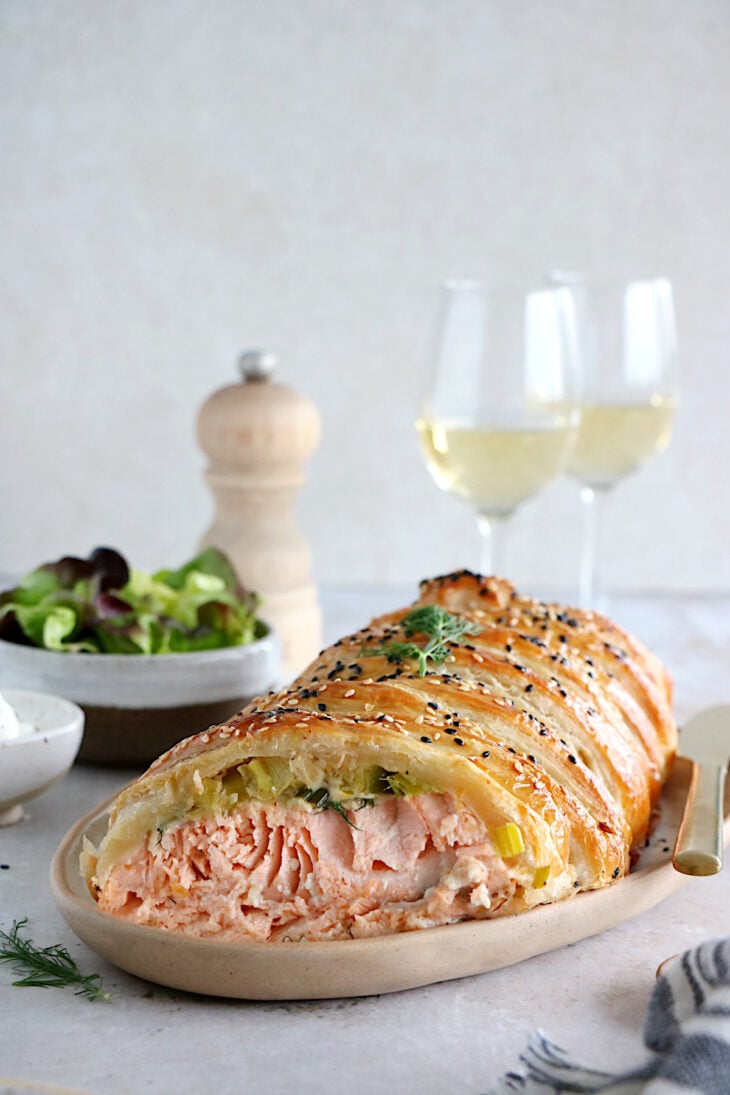 Puff pastry salmon wellington features a crispy golden puff pastry filled with a creamy leek-salmon filling, seasoned to perfection.