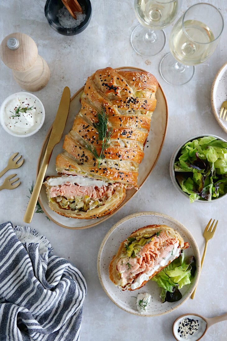 Puff pastry salmon wellington features a crispy golden puff pastry filled with a creamy leek-salmon filling, seasoned to perfection.