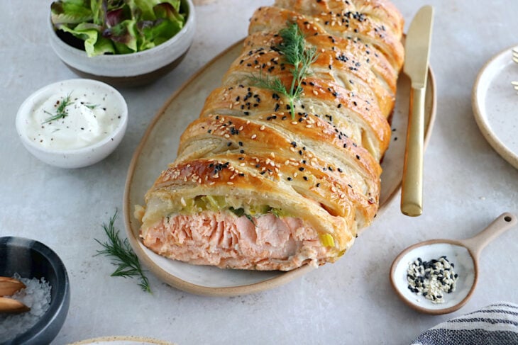 Puff pastry salmon wellington features a crispy golden puff pastry filled with a creamy leek-salmon filling, seasoned to perfection.