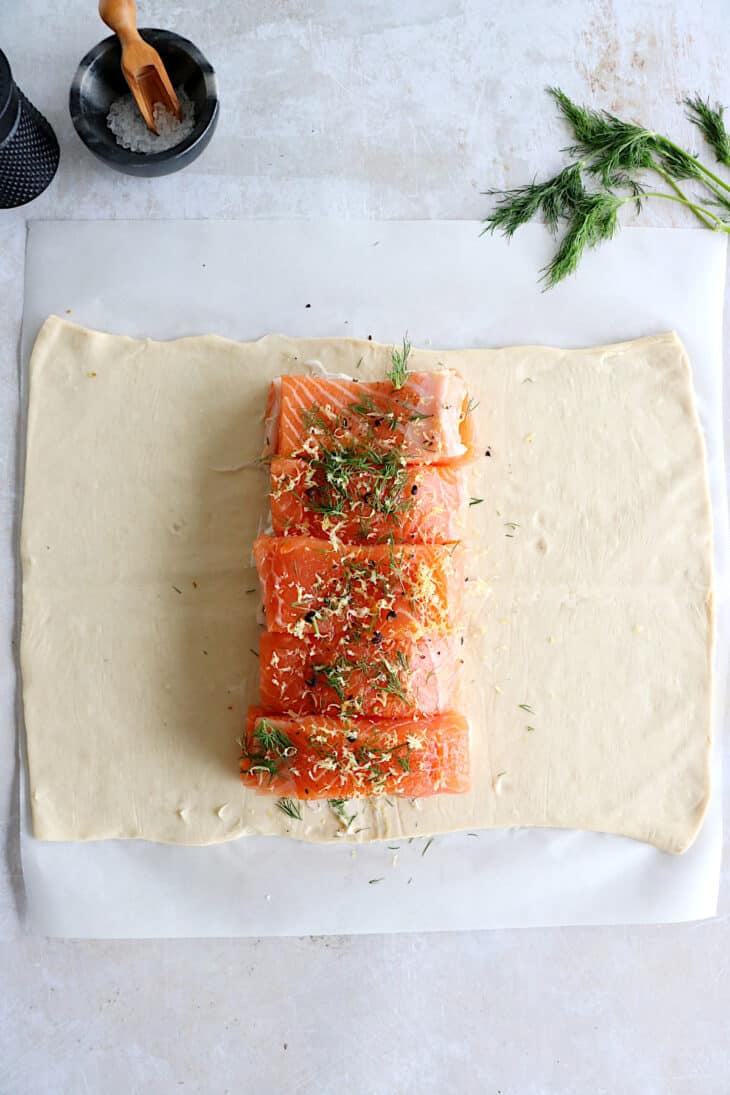 Puff pastry salmon wellington features a crispy golden puff pastry filled with a creamy leek-salmon filling, seasoned to perfection.