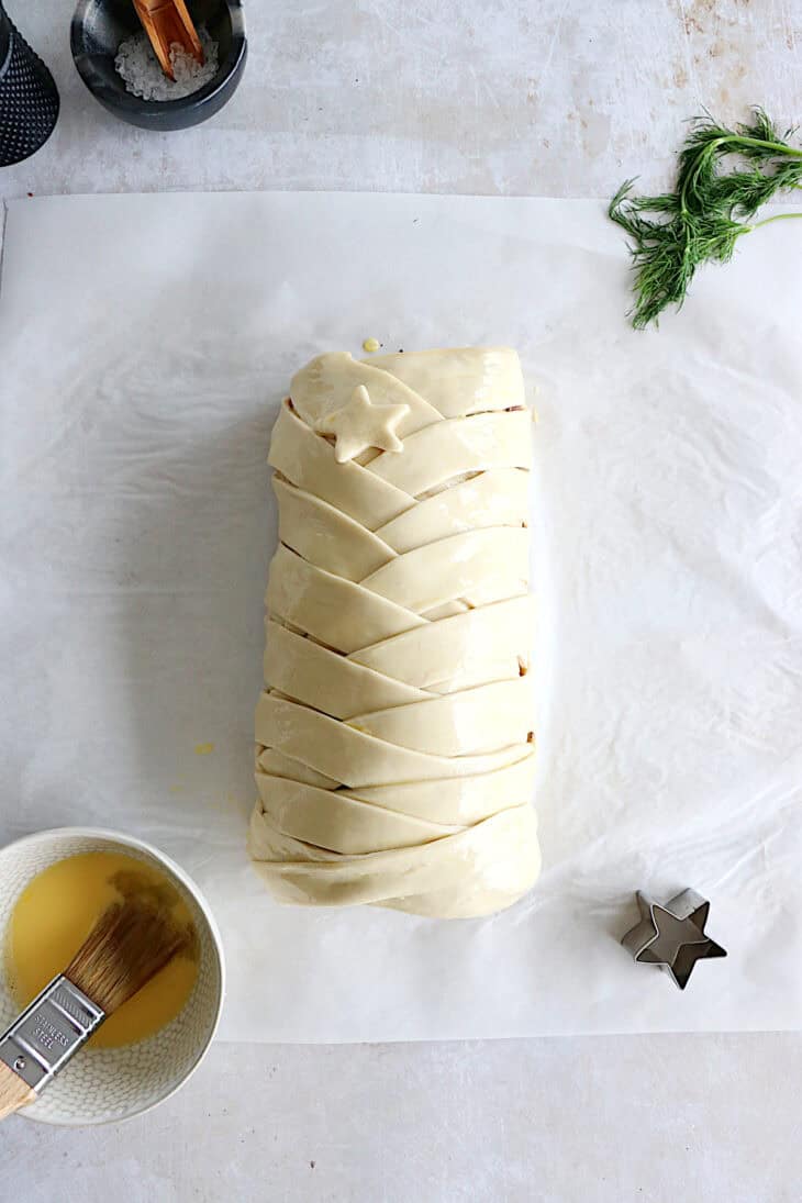 Puff pastry salmon wellington features a crispy golden puff pastry filled with a creamy leek-salmon filling, seasoned to perfection.