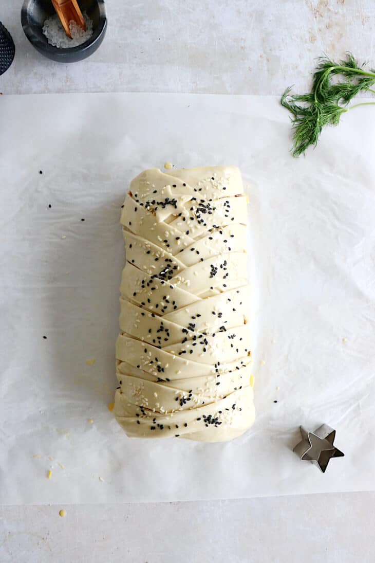 Puff pastry salmon wellington features a crispy golden puff pastry filled with a creamy leek-salmon filling, seasoned to perfection.