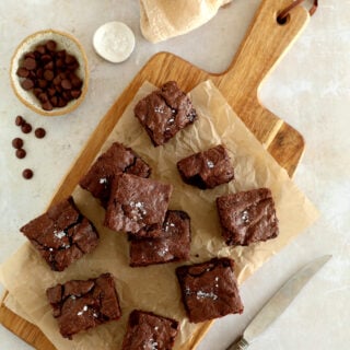 The best fudgy brownies feature a rich and moist chocolate center, with a shiny crackly top on the surface.
