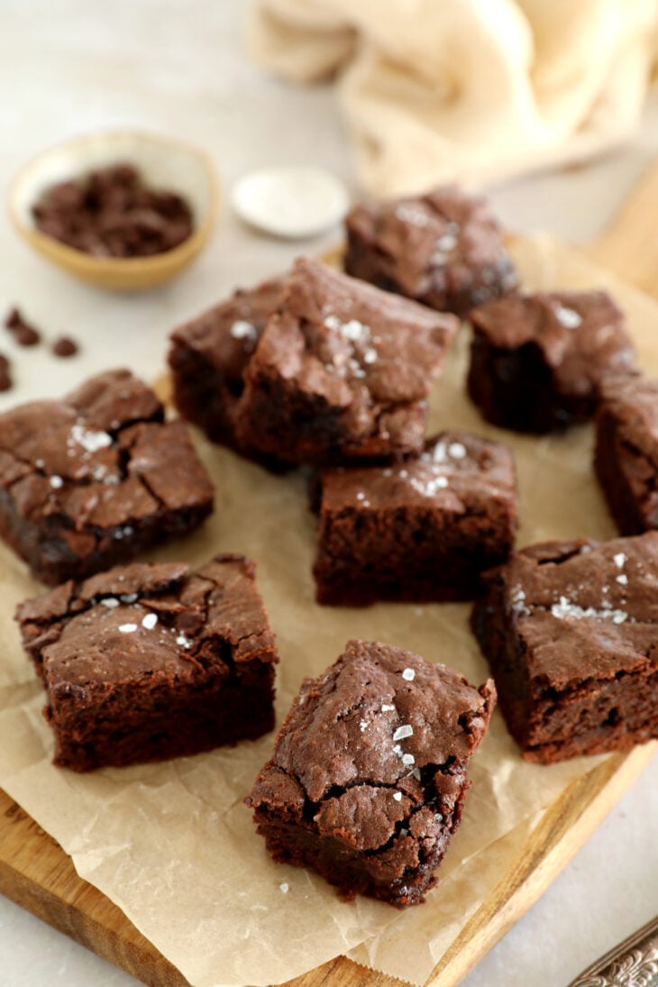 The best fudgy brownies feature a rich and moist chocolate center, with a shiny crackly top on the surface.