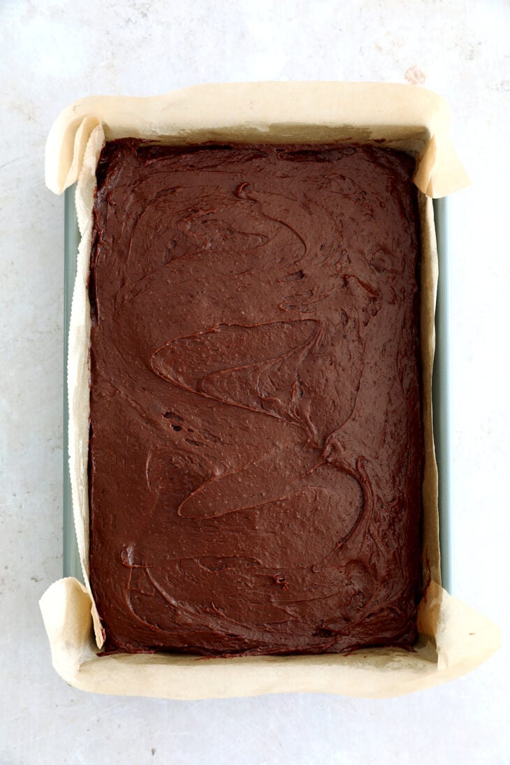 The best fudgy brownies feature a rich and moist chocolate center, with a shiny crackly top on the surface.