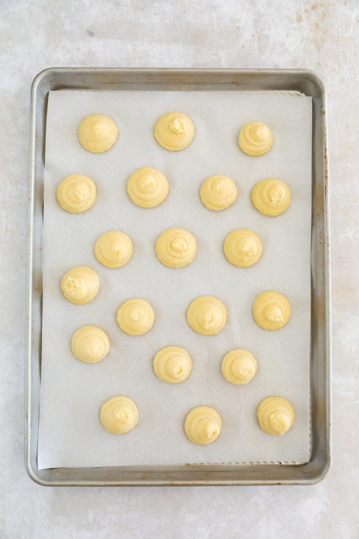 Learn how to make French chouquettes from scratch from the comfort of your home! These small hollow choux puffs topped with pearl sugar are sweet, delicate, and perfect as an afternoon snack.