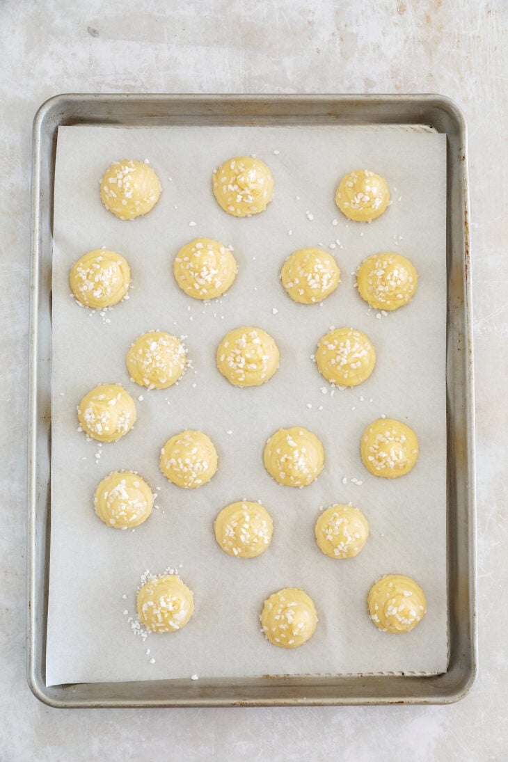 Learn how to make French chouquettes from scratch from the comfort of your home! These small hollow choux puffs topped with pearl sugar are sweet, delicate, and perfect as an afternoon snack.