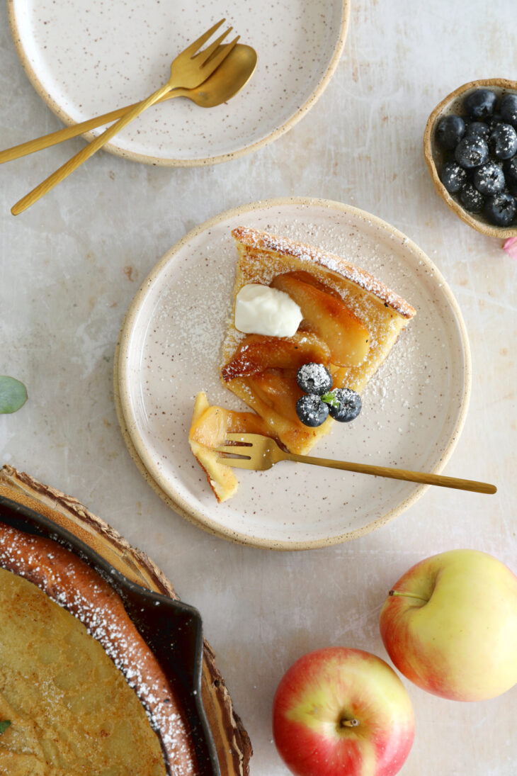 Apple Dutch Baby Pancake - Baked in a large, hot skillet, this giant pancake puffs up like a popover and is topped with caramelized apples.