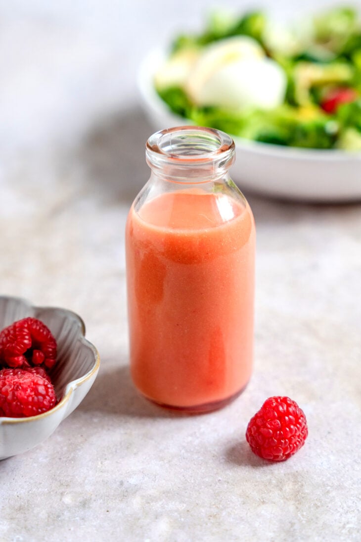 Upgrade your summer salads with this fantastic raspberry vinaigrette. Sweet and tart, with sharp flavors, this fruity dressing comes together in minutes and is absolutely fabulous!