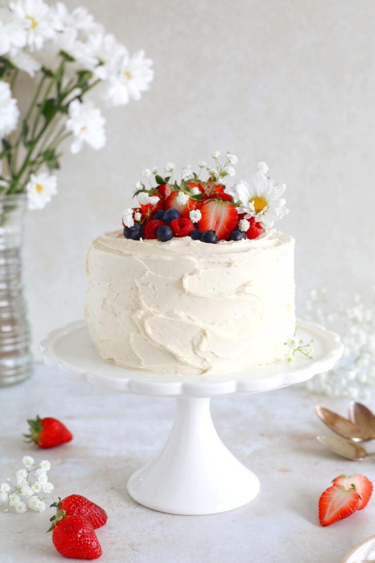 This small strawberry vanilla cake is perfect for any small celebration. It features a 6-inch two layer cake, a simple filling of strawberries and a smooth and creamy vanilla buttercream.