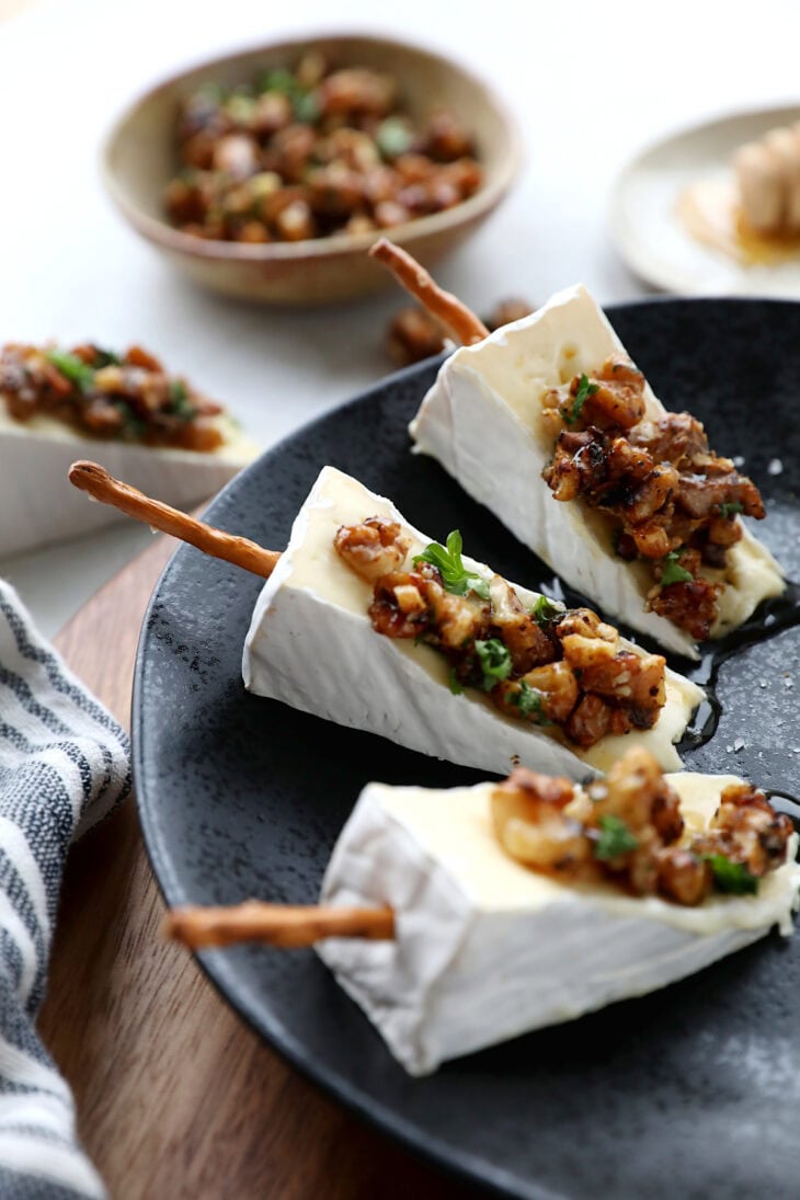 Adorable Brie cheese bites topped with caramelized walnuts. Try also the Brie Christmas tree appetizer version for the holidays.